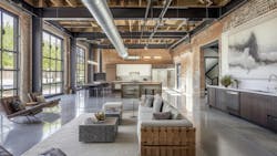 With a nod to its past as a manufacturing plant this adaptive reuse home incorporates original steel beams and exposed brick walls into its modern design. AI-generated image. With a nod to its past as a manufacturing plant this adaptive reuse home incorporates original steel beams and exposed brick walls into its modern design. AI-generated image.