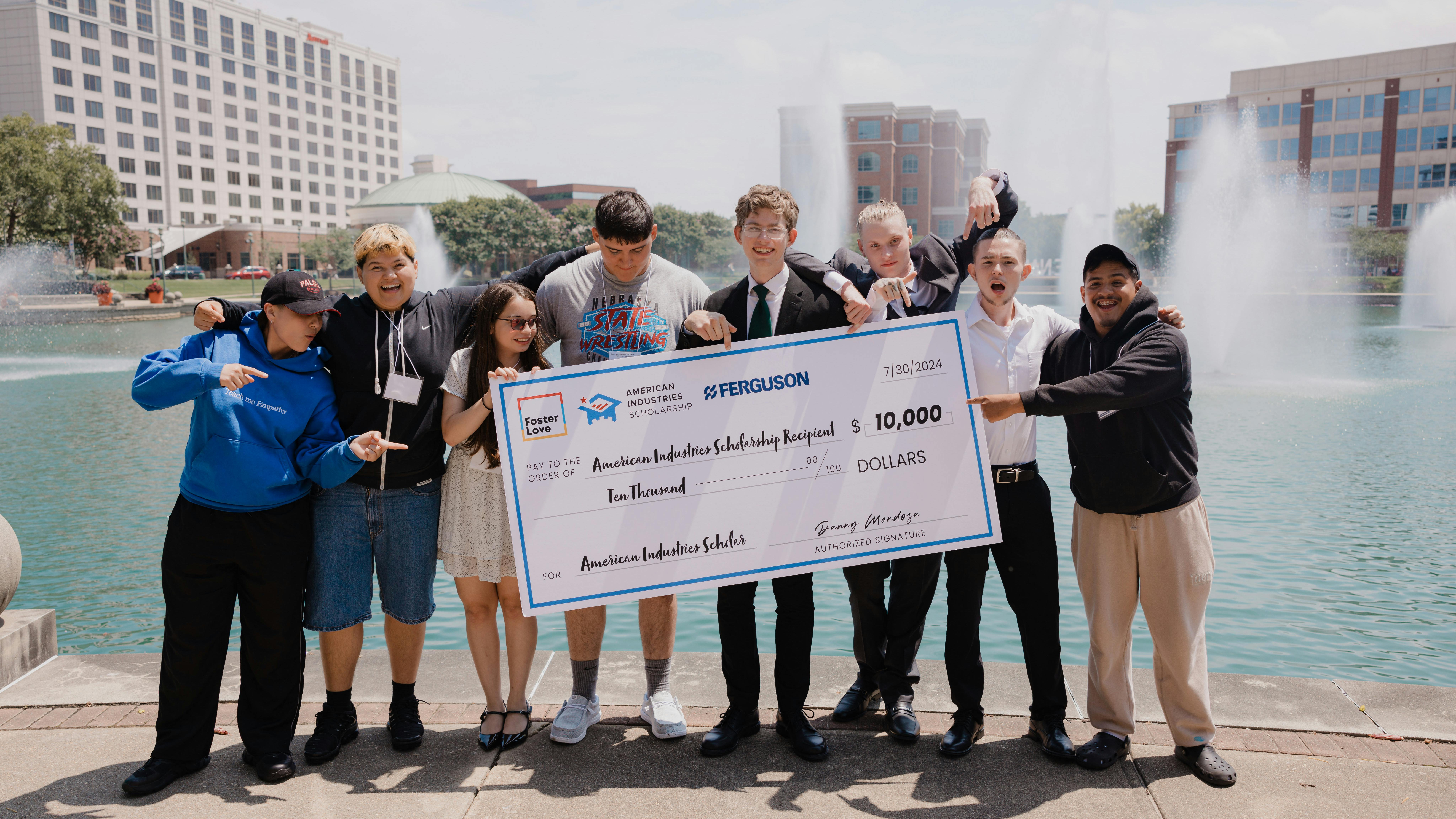 The 2024 scholarship recipients share a lighthearted moment, celebrating their new paths toward fulfilling careers in essential industries like plumbing, HVAC, and construction.