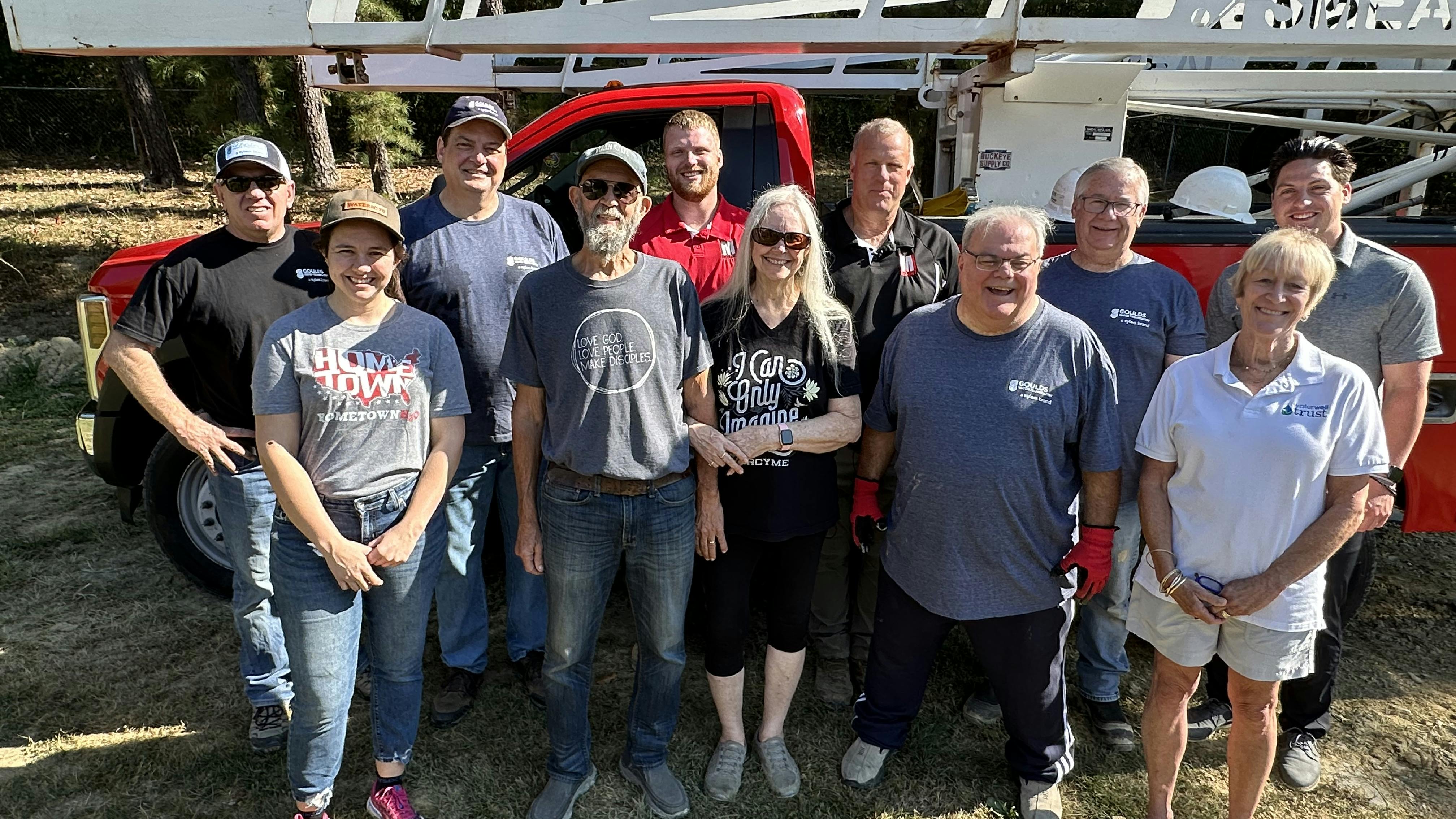 The Richards family and HometownH20 volunteers (left to right, back row to front) Brad Palmer, Doug Bergeron, Tallon Mount, Todd Mount, Scott Zody, Hayden Parker, Portia Boggs, Brett Richards, Paula Richards, Ken Capuano and Margaret Martens.