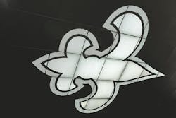 As you step inside, you first notice the massive, three-dimensional, backlit fleur-de-lis on the wall, proudly declaring it the home of the Saints. As you step inside, you first notice the massive, three-dimensional, backlit fleur-de-lis on the wall, proudly declaring it the home of the Saints.