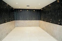 The player’s shower facilities feature a continuous trench-drain system around the entire open shower layout. The player’s shower facilities feature a continuous trench-drain system around the entire open shower layout.