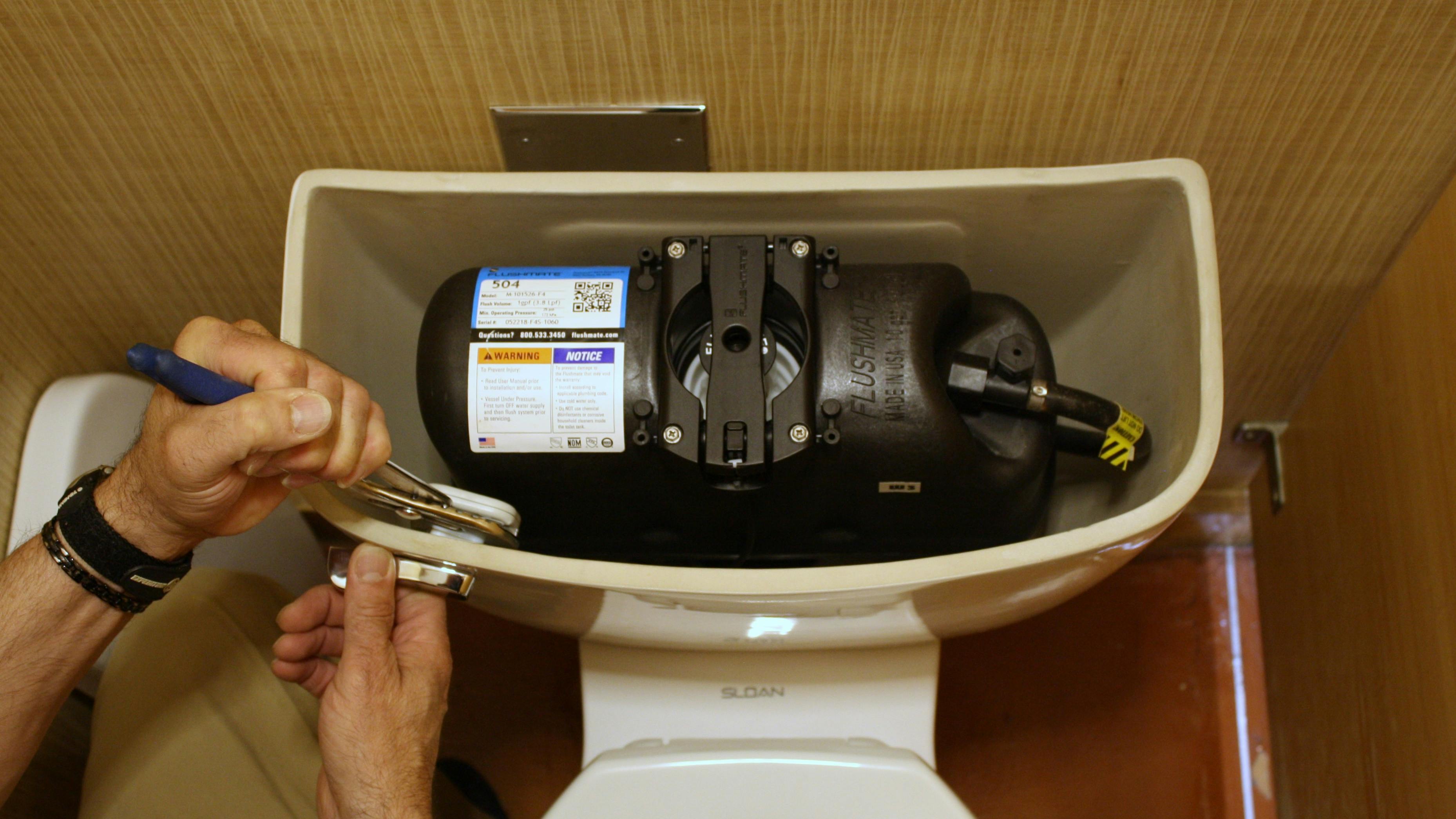 A Flushmate-equipped pressure-assisted toilet.