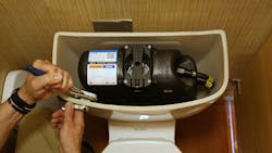 A Flushmate-equipped pressure-assisted toilet. A Flushmate-equipped pressure-assisted toilet.