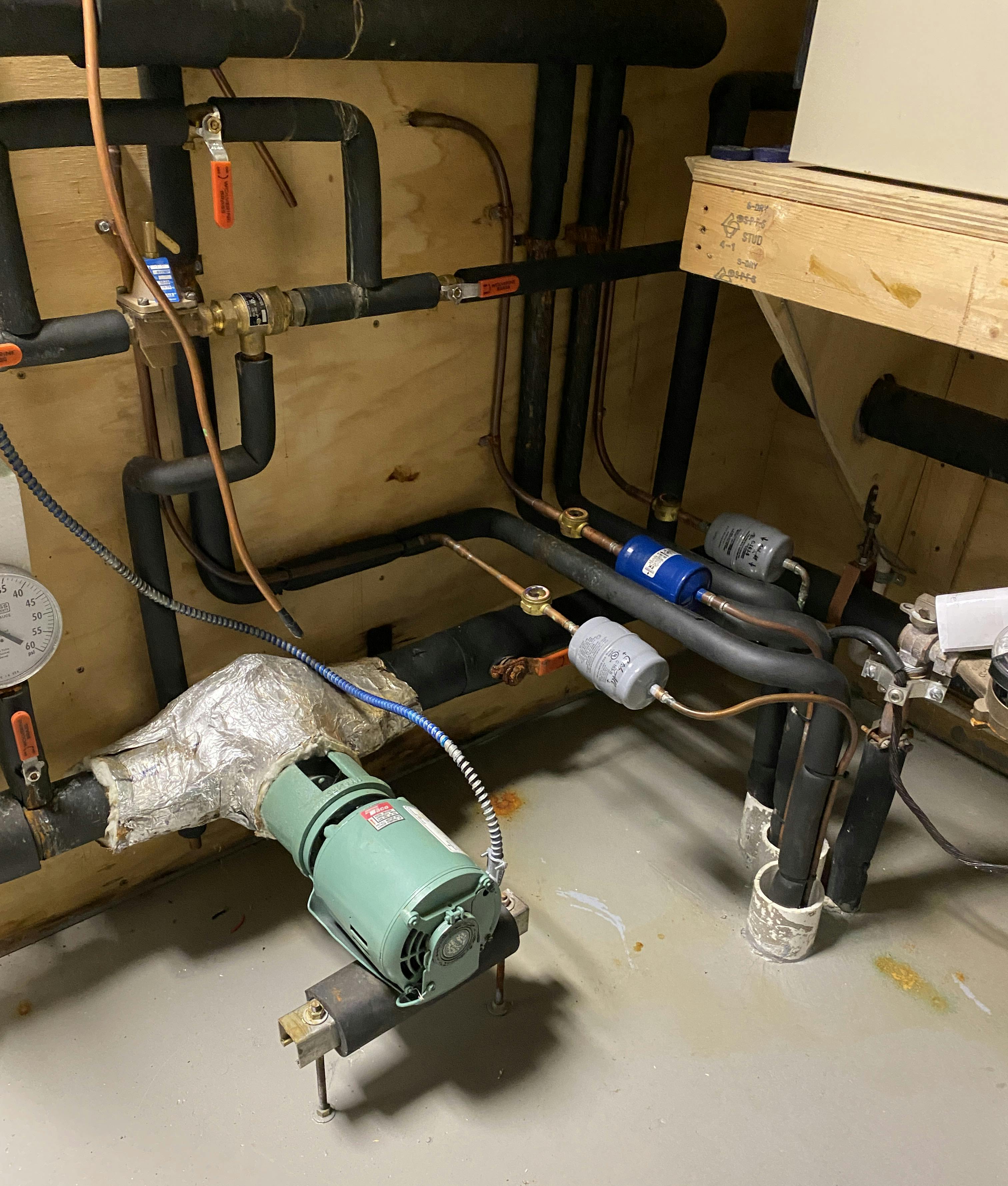 Refrigerant lines up through the floor into the mechanical room.