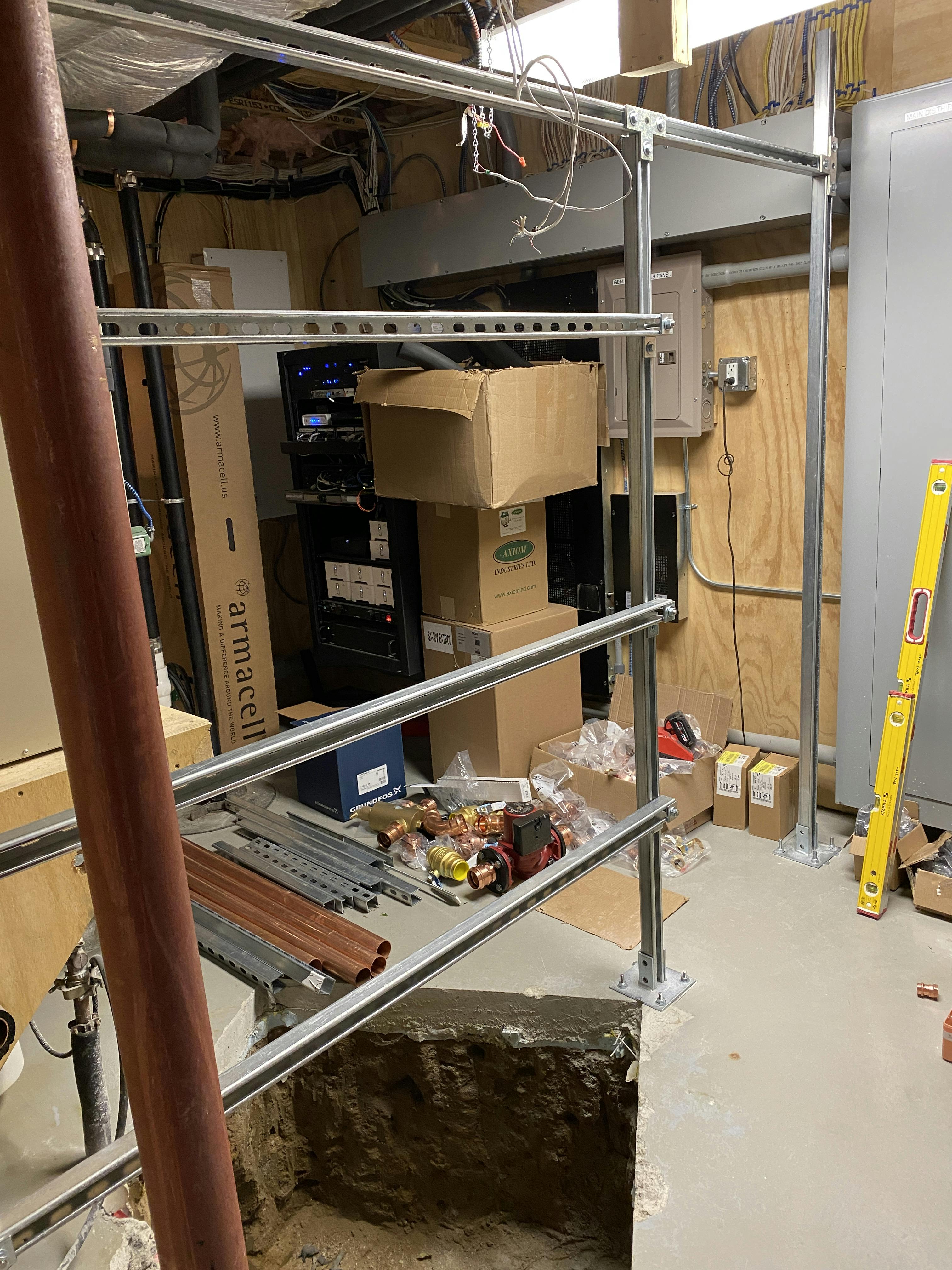 Strut frame over a hole in the mechanical room floor.