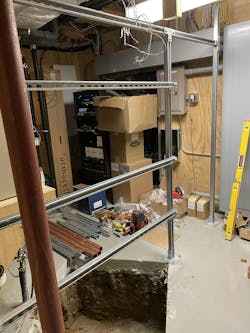 Strut frame over a hole in the mechanical room floor. Strut frame over a hole in the mechanical room floor.