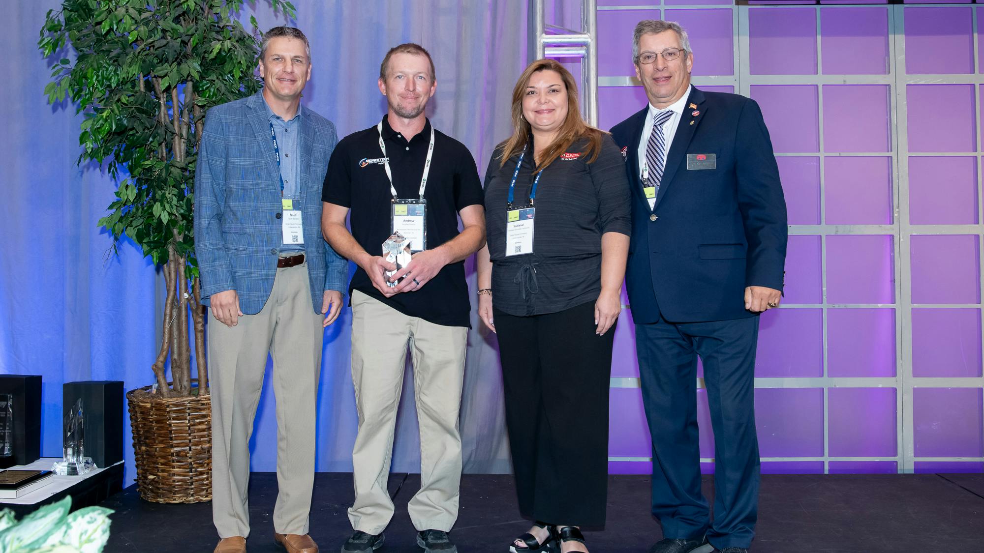 Andrew Wilson (holding trophy).