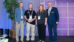Andrew Wilson (holding trophy). Andrew Wilson (holding trophy).