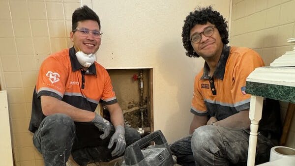 Harts technicians Ben Boss and Christopher 'Noah' Svec working to upgrade VFW Post 91.