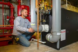 Good’s Lead Mechanic, Tom Grasse, checks venting connections on the two commercial boilers. Good’s Lead Mechanic, Tom Grasse, checks venting connections on the two commercial boilers.