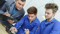 Plumbing apprentices in class. Plumbing apprentices in class.
