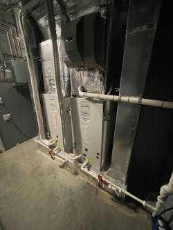 Two air handlers connected via line sets to compressor sections. Two air handlers connected via line sets to compressor sections.