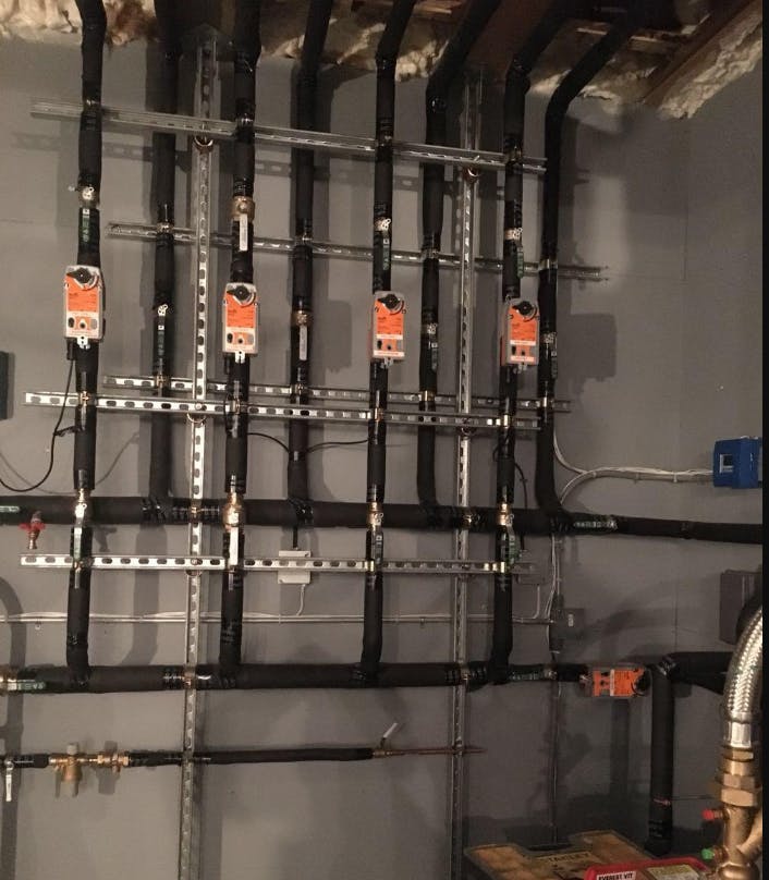 Motorized valves to remote geothermal heat pumps.