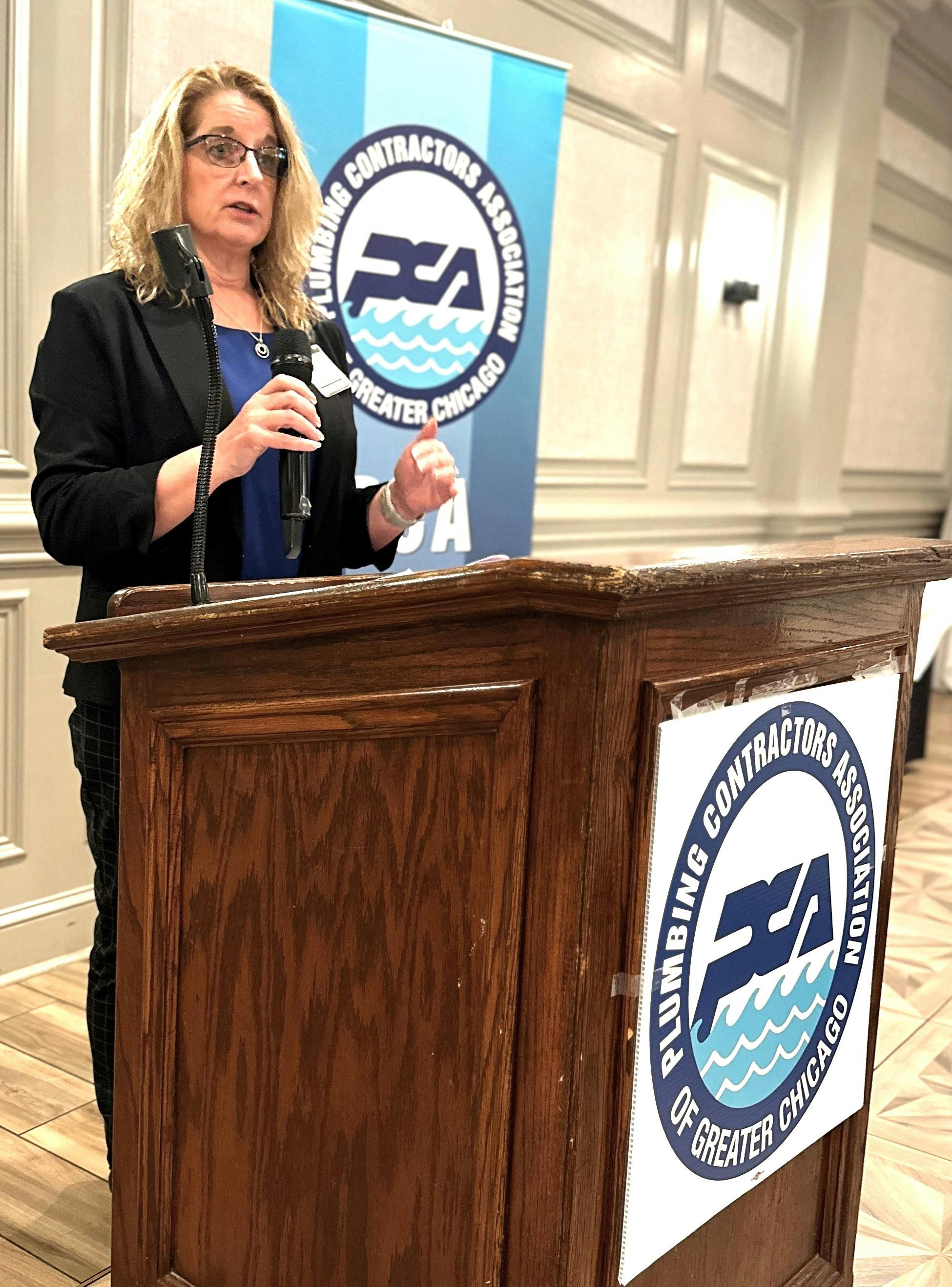 PCA President Kelly Castrogiovanni (TPC) addresses the affiliated contractors and guests at an association membership meeting in 2024.