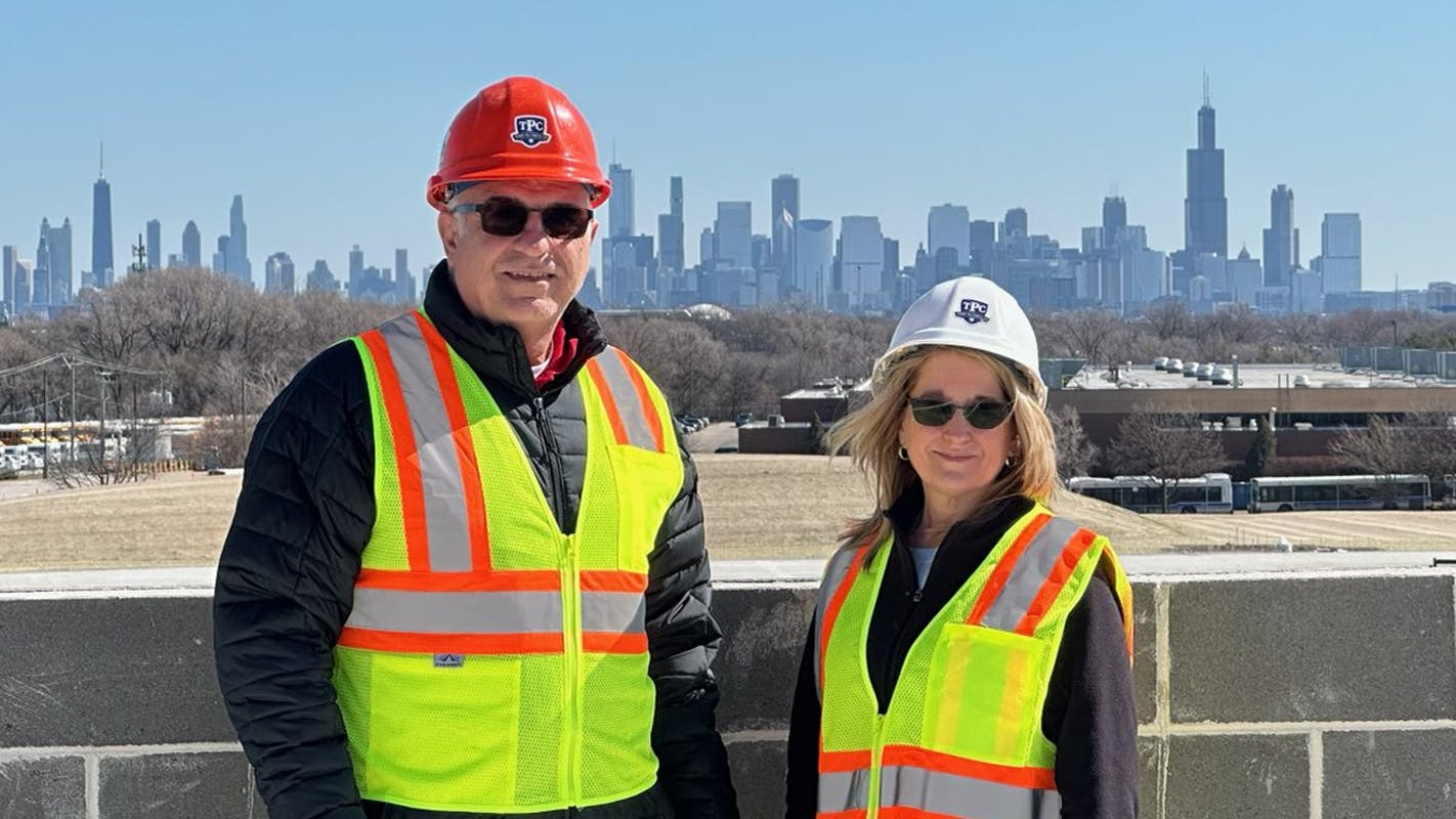 Luke and Kelly Castrogiovanni with the iconic Chicago skyline.