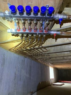 The remote basement manifold showing copper radiant loops. The remote basement manifold showing copper radiant loops.