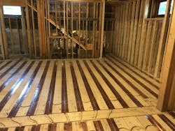 Marking loop routes on radiant copper panels. Marking loop routes on radiant copper panels.