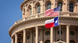 American and Texas state flags flying on the dome of the Texas State Capitol building in Austin. American and Texas state flags flying on the dome of the Texas State Capitol building in Austin.