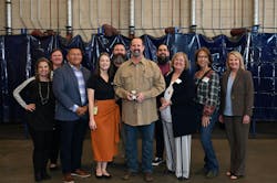 Suarez, along with award and school team. Suarez, along with award and school team.
