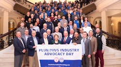 Massachusetts Gov. Maura Healey with the assembled plumbing industry representatives on the Grand Staircase of the Massachusetts State House. Massachusetts Gov. Maura Healey with the assembled plumbing industry representatives on the Grand Staircase of the Massachusetts State House.