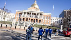 Attendees at the Massachusetts State Capitol building in Boston. Attendees at the Massachusetts State Capitol building in Boston.