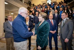 Hugh Kelleher, former president of the Greater Boston PCA, shakes hands with MA Gov. Maura Healey. Hugh Kelleher, former president of the Greater Boston PCA, shakes hands with MA Gov. Maura Healey.