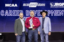 Educator of the Year Shannon Nicklaus with his award. Educator of the Year Shannon Nicklaus with his award.