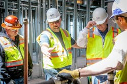An Apollo safety director points out a potential job site hazard. An Apollo safety director points out a potential job site hazard.
