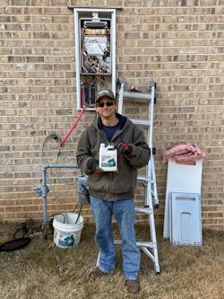 Tim Traylor, owner of T&T Plumbing prepares to flush a tankless unit. Tim Traylor, owner of T&T Plumbing prepares to flush a tankless unit.