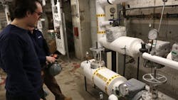 A facility manager collaborates with engineers to proactively maintain steam systems, illustrating the company's commitment to preventive maintenance and long-term efficiency gains. A facility manager collaborates with engineers to proactively maintain steam systems, illustrating the company's commitment to preventive maintenance and long-term efficiency gains.