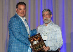 David Fink, president of PPI (left) presents the association’s Power & communications Division’s Project of the Year award to Tom Stewart of Dura-Line. David Fink, president of PPI (left) presents the association’s Power & communications Division’s Project of the Year award to Tom Stewart of Dura-Line.