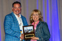 Kate Olinger of GF Building Flow Solutions (formerly Uponor) receives the PPI Building & Construction Division’s Project of the Year Award from PPI President David Fink. Kate Olinger of GF Building Flow Solutions (formerly Uponor) receives the PPI Building & Construction Division’s Project of the Year Award from PPI President David Fink.