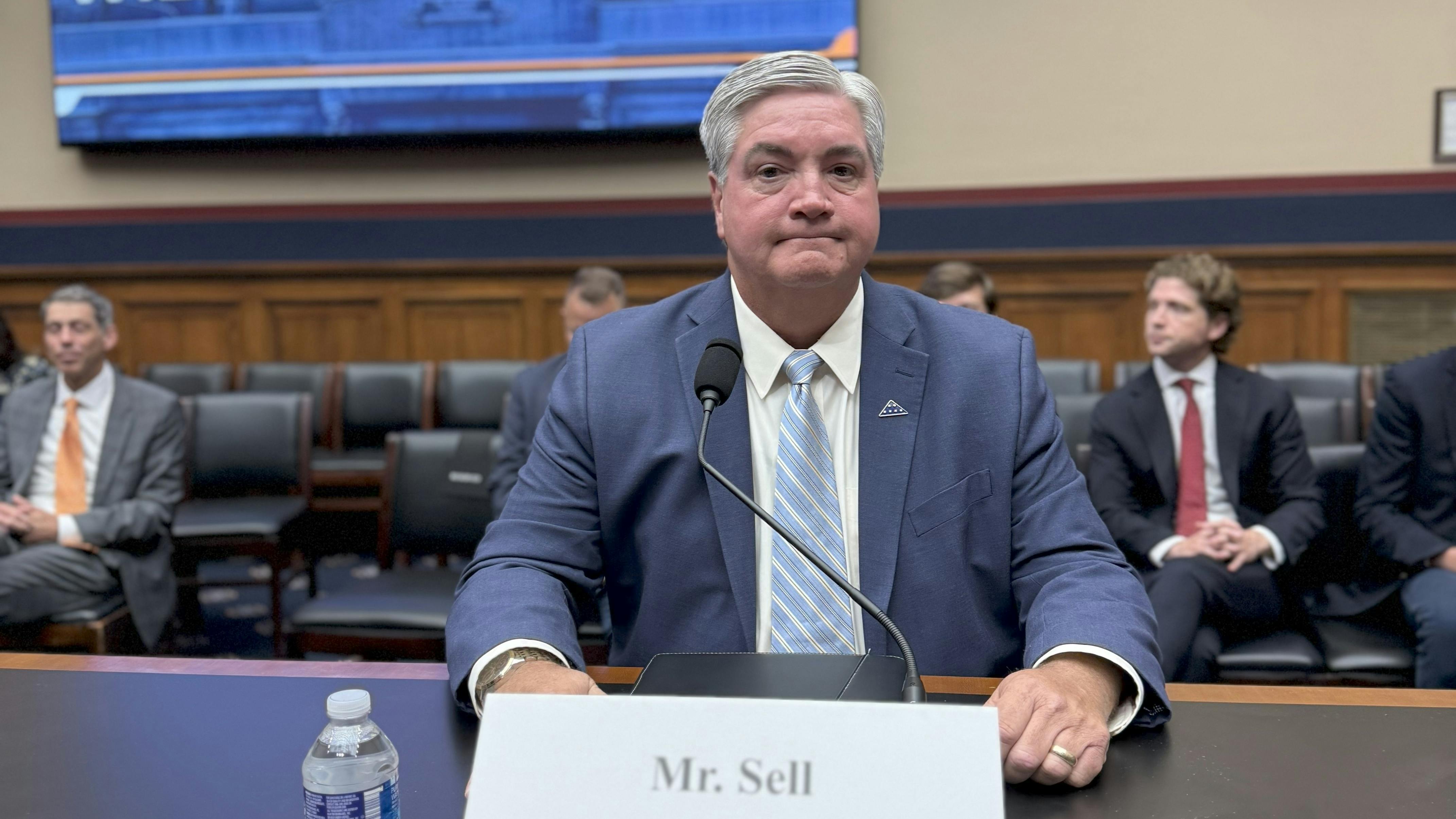 Kevin Sell prepares to give testimony before the US Congress.