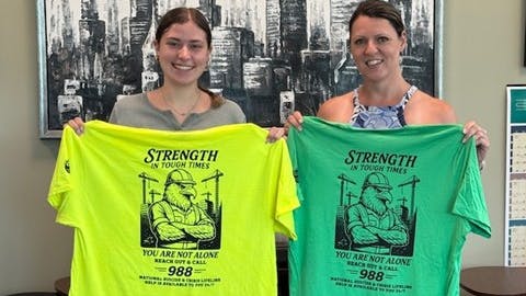 Sydney Tubin and Kelly Cancilla with the T-shirts.