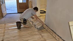 Installing a section of the radiant floor. Installing a section of the radiant floor.