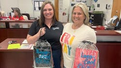 Two Air Pros USA employees at Pembroke Pines Elementary with bags of school supplies. Two Air Pros USA employees at Pembroke Pines Elementary with bags of school supplies.