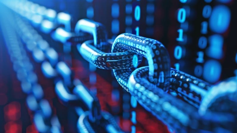 Close Up of a Chain Attached to a Wall.