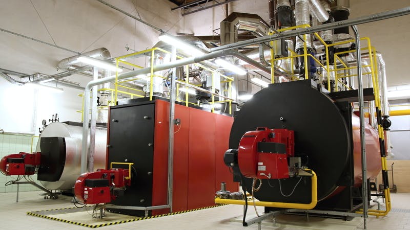 Gas boilers in gas boiler room for steam production.