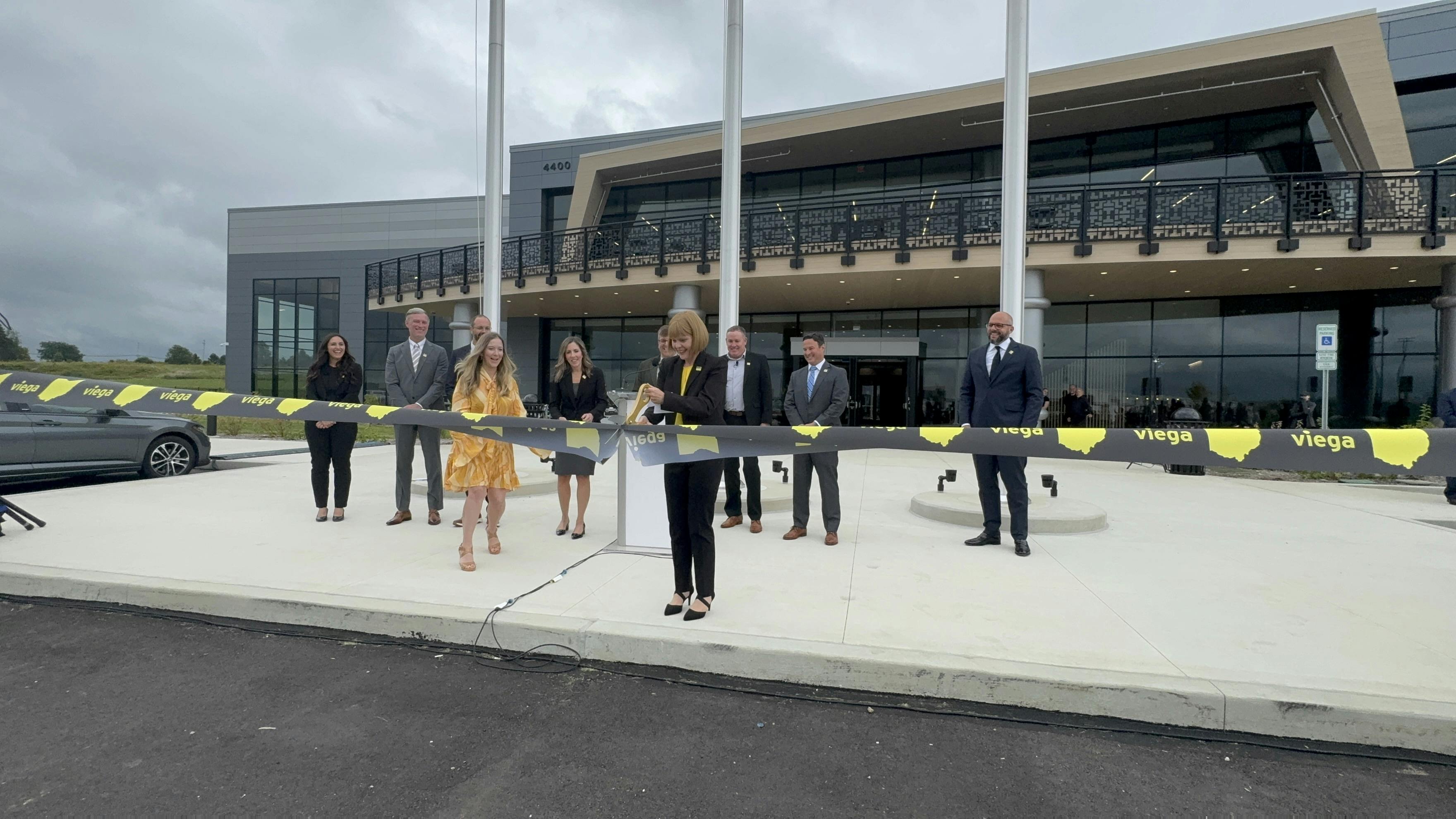Marki Huston, Viega North America CEO, cuts the ribbon, officially opening the new Ohio manufacturing plant and training facility.