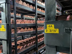 Copper billets sitting in racks. Copper billets sitting in racks.