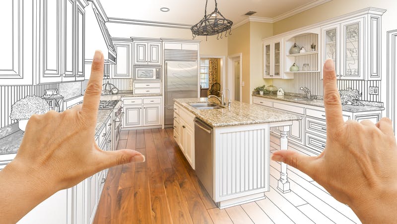 Female Hands Framing Gradated Custom Kitchen Design Drawing and Photo Combination.