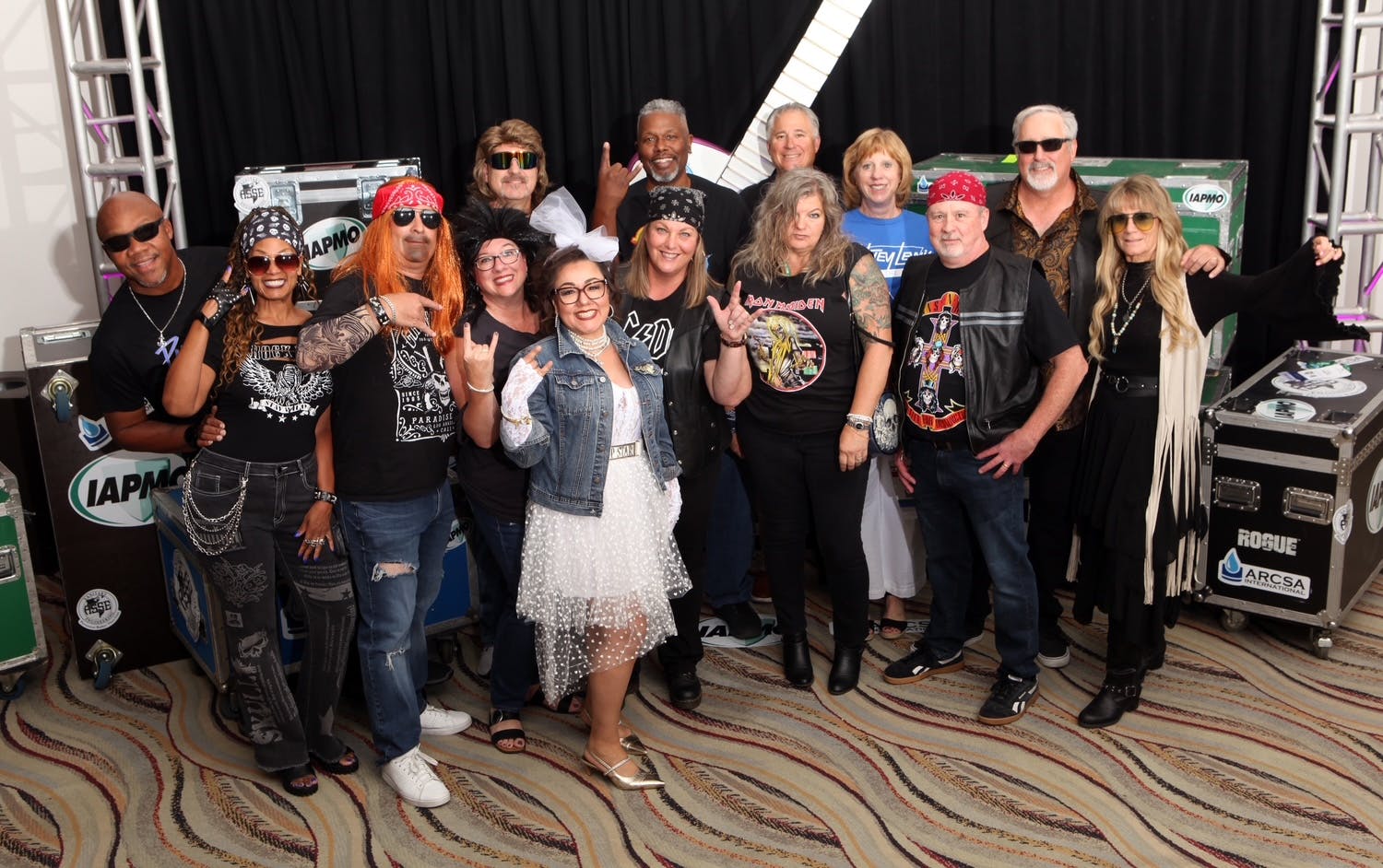 Excited attendees strike a pose in anticipation of the rock ’n’ roll-themed Welcome Dinner on Sept. 15.