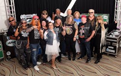 Excited attendees strike a pose in anticipation of the rock ’n’ roll-themed Welcome Dinner on Sept. 15. Excited attendees strike a pose in anticipation of the rock ’n’ roll-themed Welcome Dinner on Sept. 15.