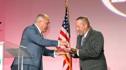 Outgoing IAPMO President Steven Panelli, left, passes the gavel to incoming President Jeremy Stettler during the Installation of Officers Dinner on Sept. 18. Outgoing IAPMO President Steven Panelli, left, passes the gavel to incoming President Jeremy Stettler during the Installation of Officers Dinner on Sept. 18.