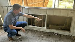 Austin Dickson inspects damage at a local arts nonprofit in Ingram, TX. Austin Dickson inspects damage at a local arts nonprofit in Ingram, TX.