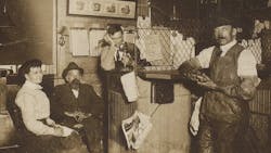 John Bouchard (seated) with employees. John Bouchard (seated) with employees.