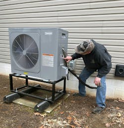 James Downs makes a few adjustements to the outdoor unit. James Downs makes a few adjustements to the outdoor unit.