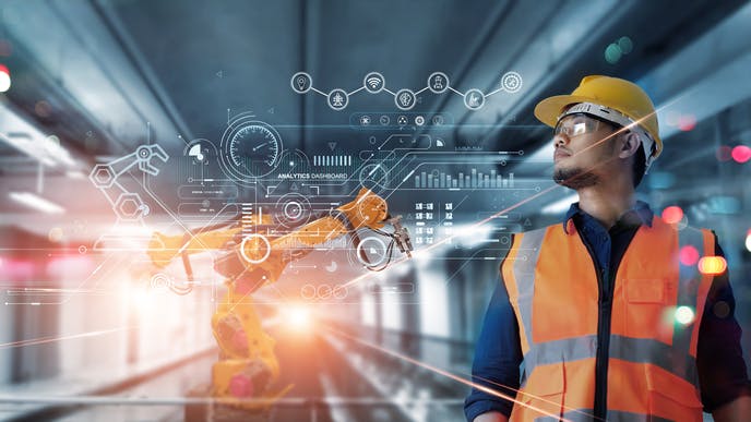 Technical Industrial Engineer working and control robotics with monitoring system software and industry network connection on modern interface.