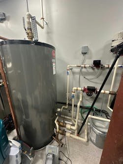 The Rheem storage tank with external piping and circulators. The Rheem storage tank with external piping and circulators.