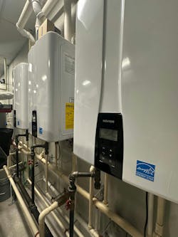 Three Navien NPE-240S2 units. Three Navien NPE-240S2 units.